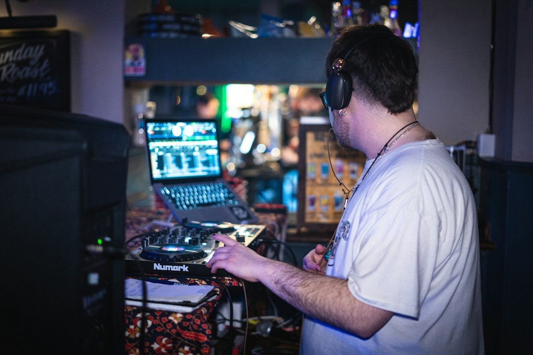 Producer reviewing broadcast footage on laptop